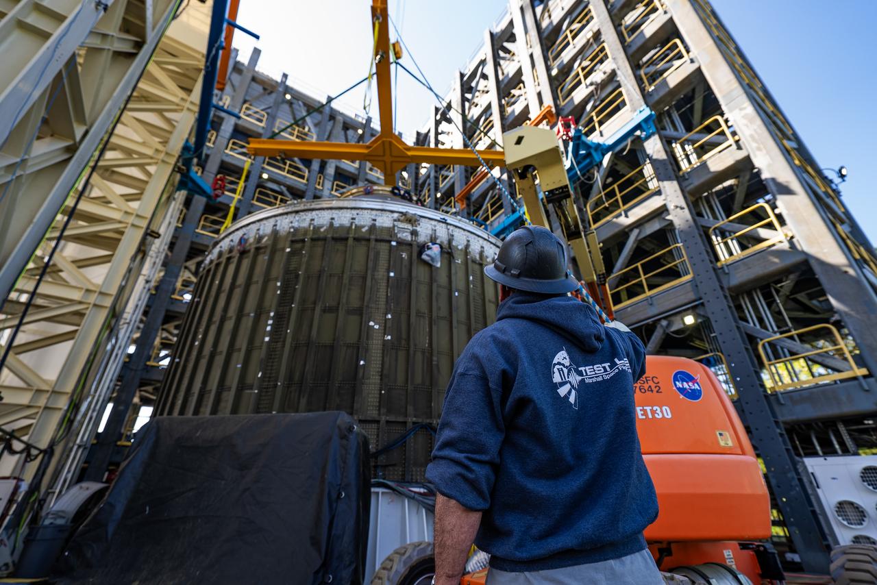 Technicians at NASA’s Marshall Space Flight Center in Huntsville, Alabama, are seen in these images taken April 17, 2025, moving the payload adapter test article from Building 4697 to Building 4705 for storage. This move marks the end of structural testing for the test article. Next, engineers will complete the qualification article and conduct additional for further testing before building the final flight hardware. Manufactured at Marshall, the test article underwent extensive and rigorous testing to validate the design before engineers finalized the configuration for the flight article. The newly completed composite payload adapter is an evolution from the Orion stage adapter to be used in the upgraded Block 1B configuration of the SLS (Space Launch System) rocket, debuting with Artemis IV.